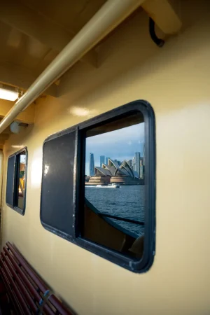 Sydney Opera House reflected in Manly Ferry window